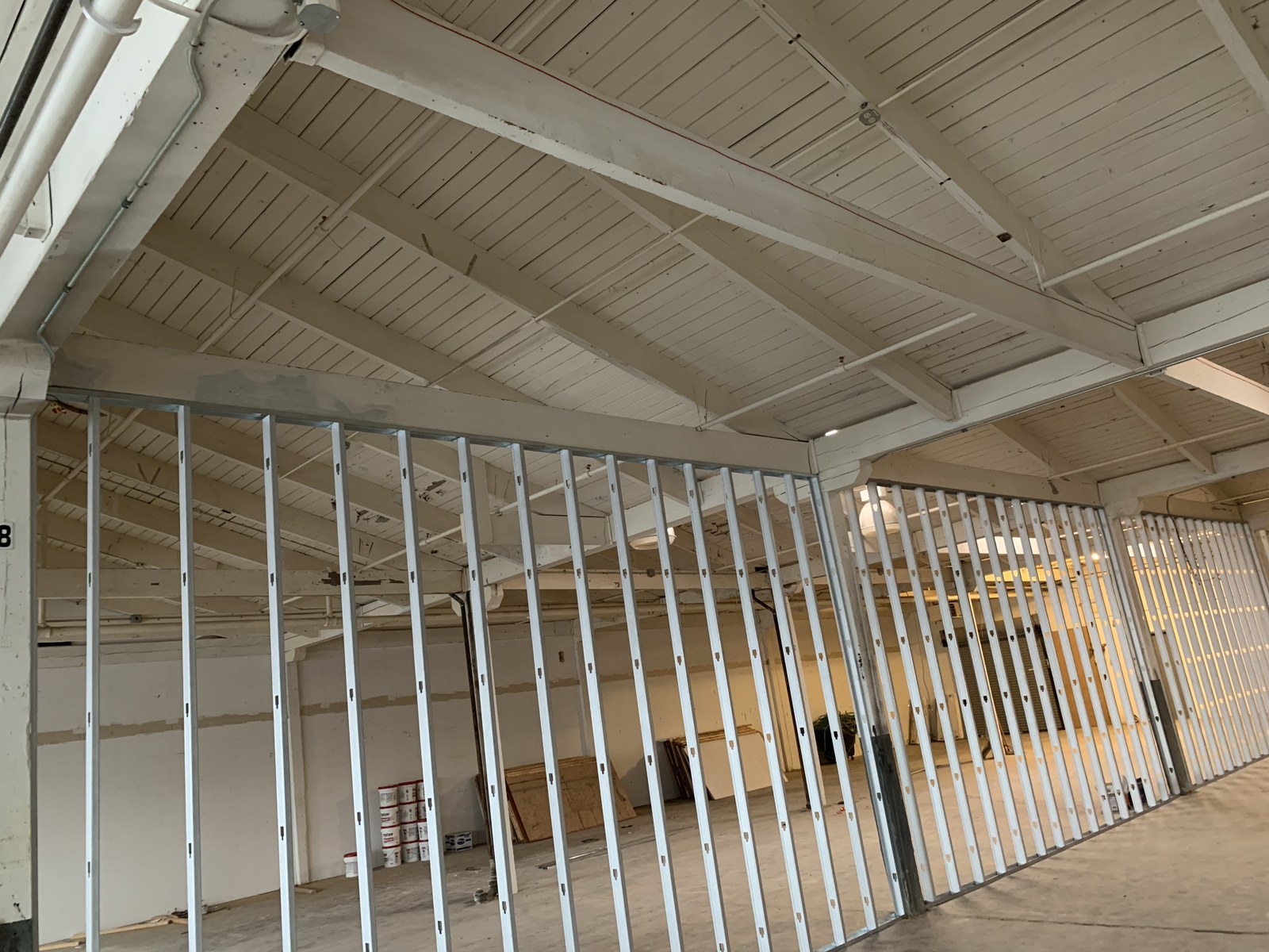 Metal framing beneath exposed ceiling structure